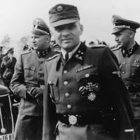 Banality of evil: Rudolf Hoss, the commandant of Auschwitz, walks the grounds of the concentration camp during World War II. His daughter Brigitte Hoss, 80, now lives a quiet, secretive life in Virginia, not even sharing her family history with close family members. Auschwitz boss' daughter lives secret life in U.S.
