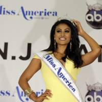 “The girl next door”: Miss America Nina Davuluri poses for photographers after her crowning in Atlantic City, New Jersey, on Sunday. Pageant winner reflects new ideal
