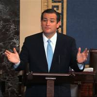 Marathon man: Texas Sen. Ted Cruz speaks on the Senate floor at the U.S. Capitol in Washington on Tuesday. Cruz, party tangle over U.S. shutdown