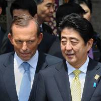 “Constant offender”: Australian Prime Minister Tony Abbott stands next to Prime Minister Shinzo Abe during a photo shoot of the leaders at the Asia-Pacific Economic Cooperation summit in Nusa Dua, on the Indonesian resort island of Bali, on Tuesday. Aussie leader dominates 'sexism awards'