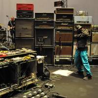 All systems go: Dommune founder Naohiro Ukawa stands with My Bloody Valentine’s equipment prior to the band’s performance at the Tokyo International Forum on Sept. 30. Ukawa promised a sound spectacular — and he delivered. Review: My Bloody Valentine at Tokyo International Forum