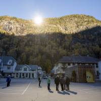 Sunrise: Three giant mirrors erected on the mountainside above Rjukan, Norway, reflect sunshine toward the center of the town below. Giant mirrors bring winter sun to remote Norwegian village