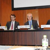 The four panelists listen to questions from the audience during a symposium in Tokyo, organized by the Keizai Koho Center on Oct. 11. Japan can learn from British experience on reform