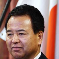 Akira Amari bloomberg CPI snaps out of four years of falling; 'Abenomics' lauded