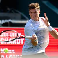 On a roll: Canada's Milos Raonic plays a shot from France's Jeremy Chardy in their second-round match at the Rakuten Japan Open on Thursday at Ariake Colosseum. Raonic won 6-4, 6-3. Nishikori, Raonic move into Rakuten Open quarterfinals