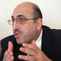 Rami Abdurrahman speaks during an interview in Coventry, England, on Oct. 10. He is practically a one man band, but Abdurrahman’s influence extends far beyond his modest home in a small English cathedral city. The 42-year-old operates the Syrian Observatory for Human Rights from his house, and a review of recent media coverage suggests its running tally of killings and clashes is the most frequently cited individual source of information on Syria’s civil war for the world’s leading news organizations Syrian activist in Britain keeps grim toll of civil war