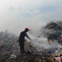 Up in smoke: The vast majority of waste collected on the Maldives is burned in open fires. Garbage island mars seascape of Maldives