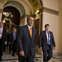 Walk on by: Republican Speaker of the House John Boehner walks to the chamber to vote on a bill to reopen the U.S. government and avert a threatened Treasury default at the Capitol in Washington on Wednesday, after a partial 16-day federal shutdown. House GOP has little to show while forcing one crisis after another