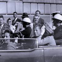 Dark day: U.S. President John F. Kennedy rides in a motorcade shortly before he was shot in Dallas on Nov. 22, 1963. The day JFK died: Fifty years on, the assassination still haunts Americans