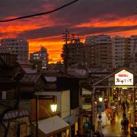 The sun sets over Yanaka Ginza. Season's greetings garnered in Tokyo's Yanaka Ginza