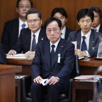 Coming clean: Mizuho Bank chief Yasuhiro Sato appears Wednesday before a Lower House committee Mizuho has more loans to the mob