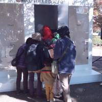 Luxury for many: Curious onlookers look at toilet stalls placed in Tokyo’s Showa Kinen Park Tuesday, as UNICEF celebrates World Toilet Day. The one in the center had no toilet to raise awareness of the lack of basic sanitation in many parts of the world. U.N. event hits lack of toilets in 39% of the world