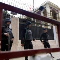 Drifting alone in a vacuum: Egyptian policemen guard the Turkish Embassy in Cairo on Saturday. Egypt downgraded diplomatic relations with Turkey and expelled its ambassador from Cairo on Saturday, a sharp escalation in tensions between the two countries that mounted after a military coup ousted the country's Islamist president this summer. Turkey mending ties with Shiite powers as regional clout wanes