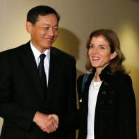 First contact: New U.S. Ambassador to Japan Caroline Kennedy (right) meets with Akitaka Saiki, vice minister for foreign affairs, at the Foreign Ministry in Tokyo on Monday. Kennedy, Saiki vow to strengthen U.S.-Japan alliance