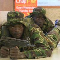 Down low: Kenyan troops take up positions inside Nairobi’s Westgate Mall on Sept. 21 after Somali militants attacked the upscale shopping complex. Unsung heroes emerge in stories of Kenyan mall attack