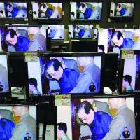 Verdict time: Monitors at a Seoul electronics store on Friday show Jang Song Thaek’s court appearance in Pyongyang. Jang purge shows North power base is unstable
