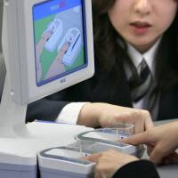 As easy as it gets: A foreigner places his digits on a fingerprint reading device at the immigration control area in Narita International Airport. From finding a residence status that suits your circumstances to signing up a sponsor, getting a visa to stay in Japan for the long term can be a challenge. To stay here long term, visa seekers need to prove they can pay their way