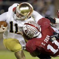 Collared: Stanford linebacker Shayne Skov sacks Notre Dame QB Tommy Rees in the second half on Saturday night. The Cardinal beat the Fighting Irish 27-20. Lyons helps Stanford hold off Notre Dame