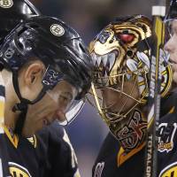 Meeting of the minds: Bruins winger Jarome Iginla (left) shares a moment with goalie Tuukka Rask during Friday’s game against the Senators. Rask blanks Senators