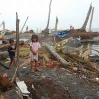 Total devastation: Along the beach in Dulag, all the houses and trees were destroyed by Typhoon Haiyan when it hit Leyte Island last month. Haiyan victims still suffering as Christmas nears
