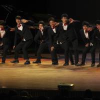 “Brothers” in arms: North Korean defectors reared by Kim Tae-hoon perform during their concert “With Friend” at Mapo Art Center in Seoul on Nov. 9. Young North Korean defectors find 'family' in man's home