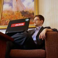 “Indoor cat”: Edward Snowden is seen in a hotel room in Moscow earlier this month. Snowden declares his mission accomplished