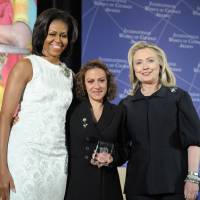 Speaking the unspeakable: Colombia’s Jineth Bedoya Lima (center), the 2012 winner of the International Women of Courage Award, poses for a photo in March 2012 with then-U.S. Secretary of State Hillary Rodham Clinton (right) and first lady Michelle Obama. Story of ‘systematic’ exploitation of women becomes reporter’s life