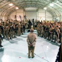 Rallying the troops: U.S. Secretary of Defense Chuck Hagel speaks with U.S. troops at Camp Bastion, Afghanistan, on Sunday to thank them for being deployed during the Thanksgiving holidays. Hagel talks drones and Afghan peace with Pakistan's Sharif