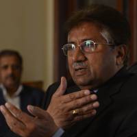 Fighting back: Pakistan's former military ruler Pervez Musharraf addresses foreign media representatives at his farmhouse in Islamabad on Sunday. Musharraf says army backs him over treason 'vendetta'