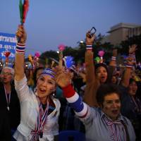 Building momentum: Anti-government protesters shout slogans during a rally at the Democracy Monument in Bangkok on Sunday. Thai crisis deepens as opposition leaves Parliament in protest