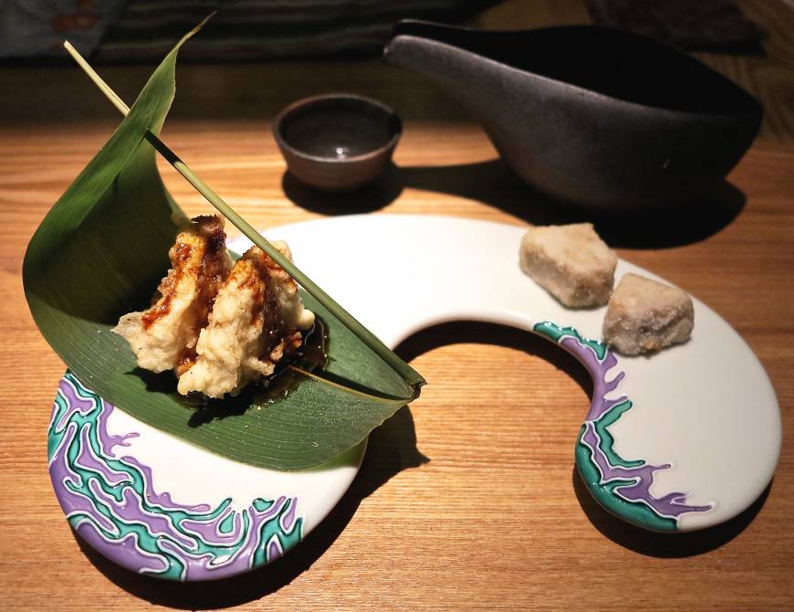 Kagurazaka Girogiro Psychedelicious: GiroGiro's playful spirit is evident in its new Tokyo branch, with unusual dishes including foie gras and battered lotus root on a bamboo-grass leaf. | ROBBIE SWINNERTON