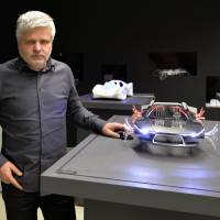 Unstuck in traffic: Slovakian engineer Stefan Klein shows some of his car models in Bratislava on Dec. 17. Back to the future: Flying car spreads its wings in Slovakia