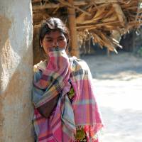 Unsheltered: A woman stands in a doorway in Subalpur, whose village council allegedly ordered the Jan. 20 gang rape of a female resident. Gang rape order revives scrutiny of India village councils