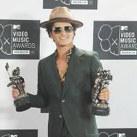 Take the field: Bruno Mars shows off his MTV Video Music Award at the Barclays Center in New York on Aug. 25. Chili Peppers to join Mars at Super Bowl