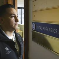 New battlefield: Army Staff Sgt. Oskar Zepeda stands at the entrance to the digital forensics laboratory at an Immigration and Customs Enforcement field office in Seattle where he is serving a one-year internship. Wounded veterans now target child predators