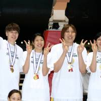 How sweet it is: JX-Eneos Sunflowers players celebrate the team’s Empress’ Cup title on Sunday, a 69-61 win over Toyota Motors Antelopes. Sunflowers reign supreme in Empress' Cup