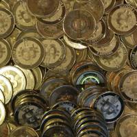 Bitcoins are seen in Sandy, Utah, last April. The website of major exchange Mt. Gox went offline Tuesday. Mt. Gox website disappears amid huge Bitcoin theft claim