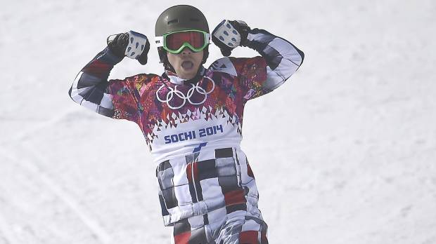 Wild at heart: Russia’s Vic Wild strikes a pose after crossing the finish line in Wednesday’s quarterfinals. Snowboard couple haul in medals