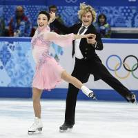 Perfect harmony: Meryl Davis and Charlie White perform their short dance at the Iceberg Skating Palace on Sunday. U.S. dancers set world record