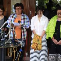 Rescued Japanese divers (from right) Nahomi Tomita, Atsumi Yoshidome, Emi Yamamoto and Aya Morizono talk to media at a hospital in Bali, Indonesia, after they were discharged Thursday. Four divers heading home after ordeal off Bali