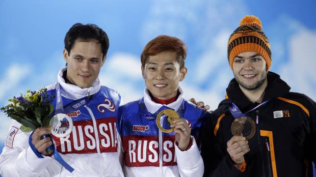 Where I belong: Viktor Ahn (center) will leave the games with four medals after winning gold in the 500 meters and 5,000-meter relay Friday. Ahn skates to more glory for Russia