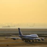 Into the sunset: A Boeing Co. 747-400 operated by All Nippon Airways Co. prepares to take off from Haneda airport in Tokyo on Jan. 30, 2013. ANA offering tour to say goodbye to Boeing 747