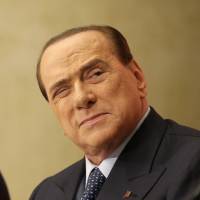 Former Prime Minister Silvio Berlusconi attends the launch of the book Sale, zucchero e caffe (Salt, Sugar and Coffee) by his friend, journalist Bruno Vespa, in Rome last Dec. Berlusconi bribery trial gets under way