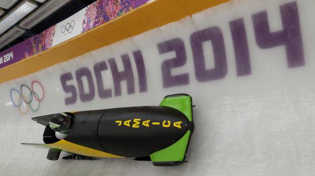 As cool as ever: The Jamaican bobsled takes a turn during a practice run on Thursday in Krasnaya Polyana, Russia. Jamaican bobsled team on track after luggage mishap