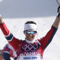 That winning feeling: Norway’s Marit Bjoergen celebrates her victory in the women’s 30K cross-country race in Krasnaya Polyana, Russia, on Saturday. Bjoergen guides Norway to sweep in women's 30-km cross-country race