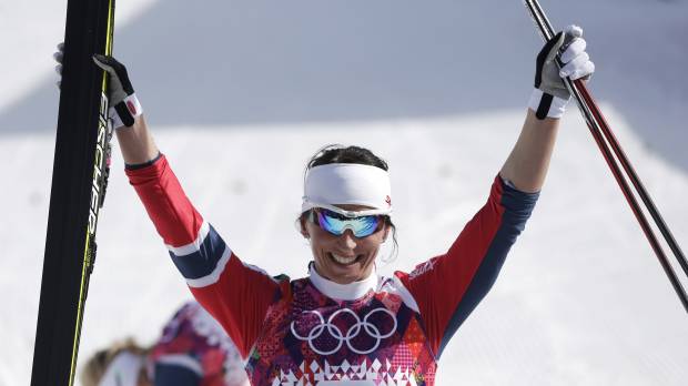 That winning feeling: Norway’s Marit Bjoergen celebrates her victory in the women’s 30K cross-country race in Krasnaya Polyana, Russia, on Saturday. Bjoergen guides Norway to sweep in women's 30-km cross-country race