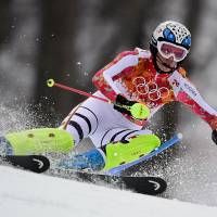 Ave Maria: Germany's Maria Hoefl-Riesch skis on her way to gold in the women's super-combined at the Sochi Olympics on Monday. Hoefl-Riesch defends super-combined title