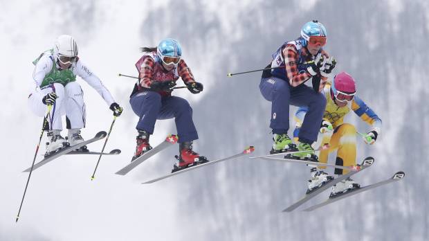 Aerial intensity: (From left) France's Ophelie David, from left, Canada's Kelsey Serwa, Canada's Marielle Thompson and Sweden's Anna Holmlund race during the women's ski-cross final in Krasnaya Polyana, Russia, on Friday. Canada takes top two spots in women's ski-cross final