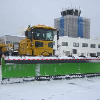 One of White Impulse’s snowplows with the Aomori Airport terminal building in the background. Aomori Airport’s Snow Removal Team: 'White Impulse'