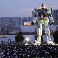 Silent defender: Giant robots, such as this 18-meter-high Gundam in Tokyo's Odaiba, are the subject of a government white paper. Giant robots officially fly the flag for cool Japan